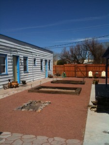 Before filling the planters with dirt.
